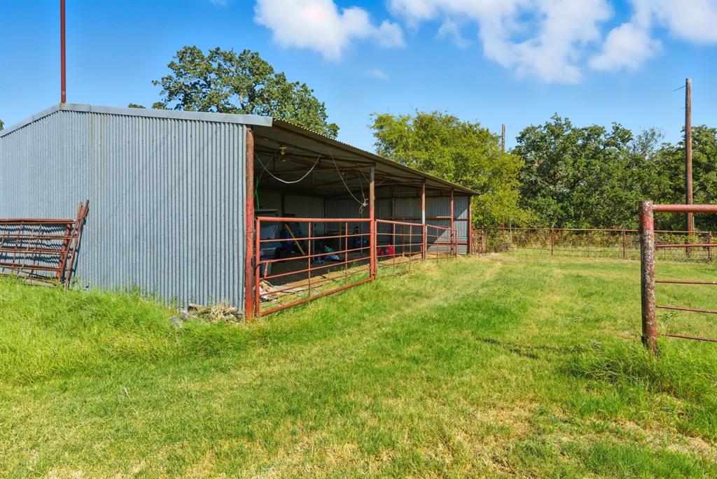 1734 Davis Road Lipan, TX 76462 - Photo 29 of 40 a view of a backyard with wooden fence and plants