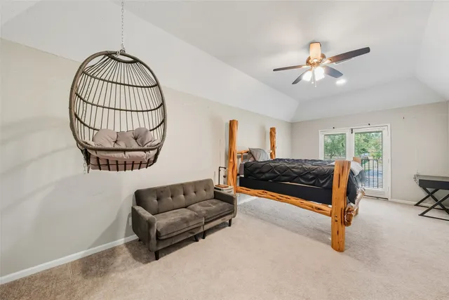 a living room with furniture a ceiling fan and a window