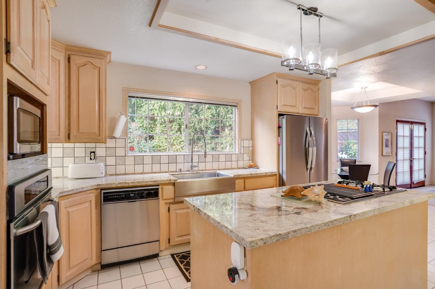 1383 Van Dusen Lane Campbell, CA 95008 - Photo 11 of 58 a kitchen with stainless steel appliances granite countertop a sink stove and refrigerator