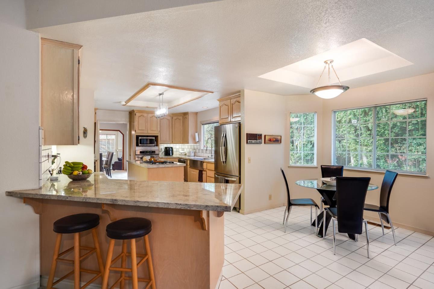 1383 Van Dusen Lane Campbell, CA 95008 - Photo 15 of 58 a dining table chair with a kitchen island granite countertop furniture and a chandelier