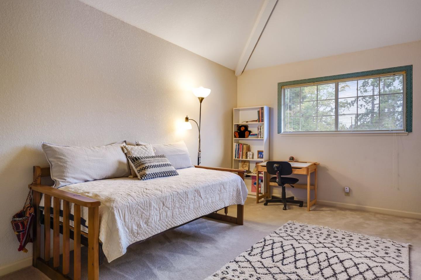 1383 Van Dusen Lane Campbell, CA 95008 - Photo 32 of 58 a bedroom with a bed and a table