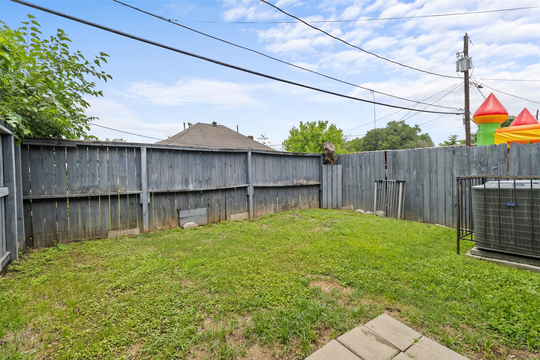 6706 Lozier Street Houston, TX 77021 - Photo 28 of 32 a backyard of a house with lots of green space and wooden fence