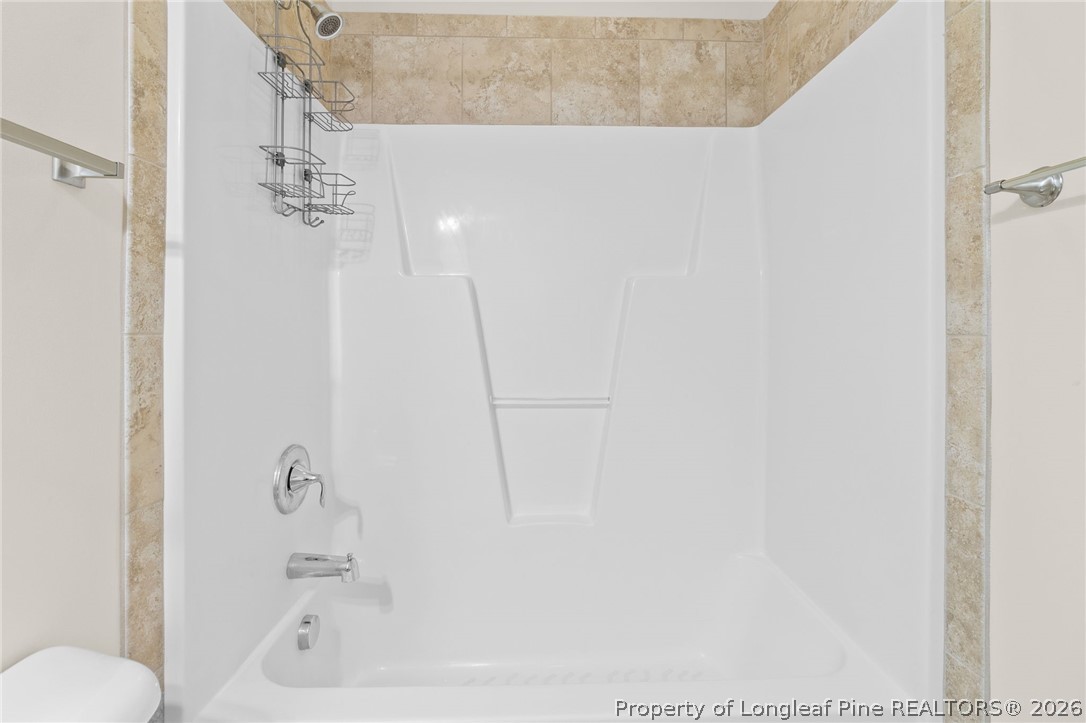 216 Meherrin Loop Raeford, NC 28376 - Photo 25 of 38 a bath tub sitting next to a white sink