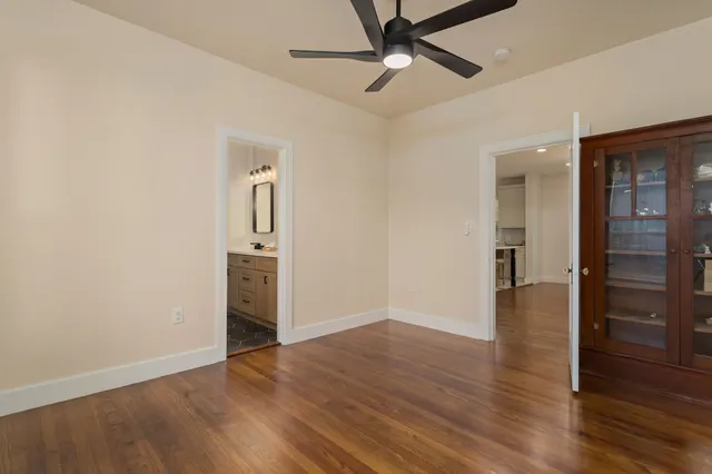 a bathroom with a double vanity sink and mirror