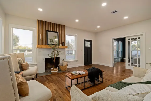 a living room with furniture and a fireplace
