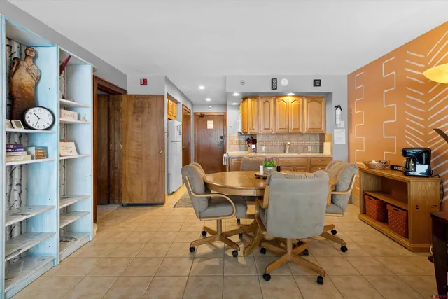 a view of a dining room with furniture window and outside view