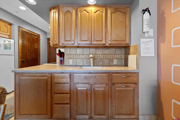 a kitchen with stainless steel appliances a sink and cabinets