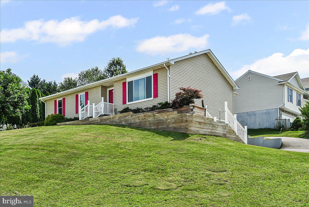a view of a house with a big yard