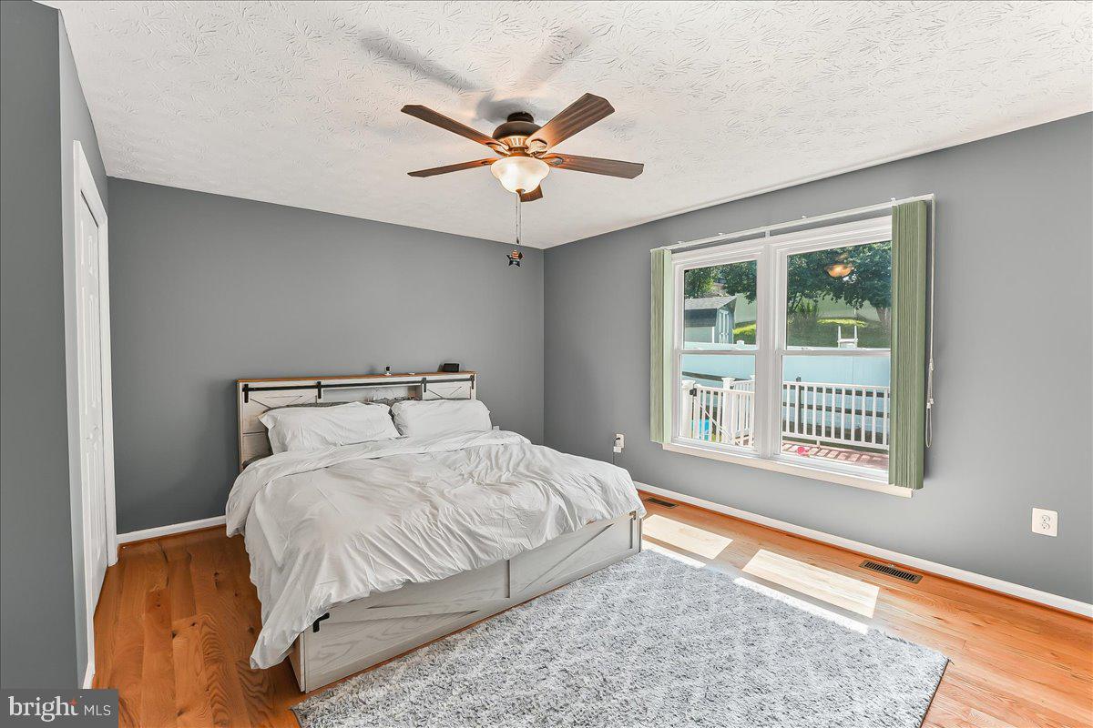 107 Britton Drive Rising Sun, MD 21911 - Photo 20 of 30 a bedroom with a large bed and a window