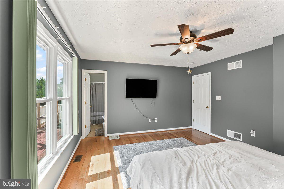 107 Britton Drive Rising Sun, MD 21911 - Photo 21 of 30 a bedroom with a bed and a flat screen tv