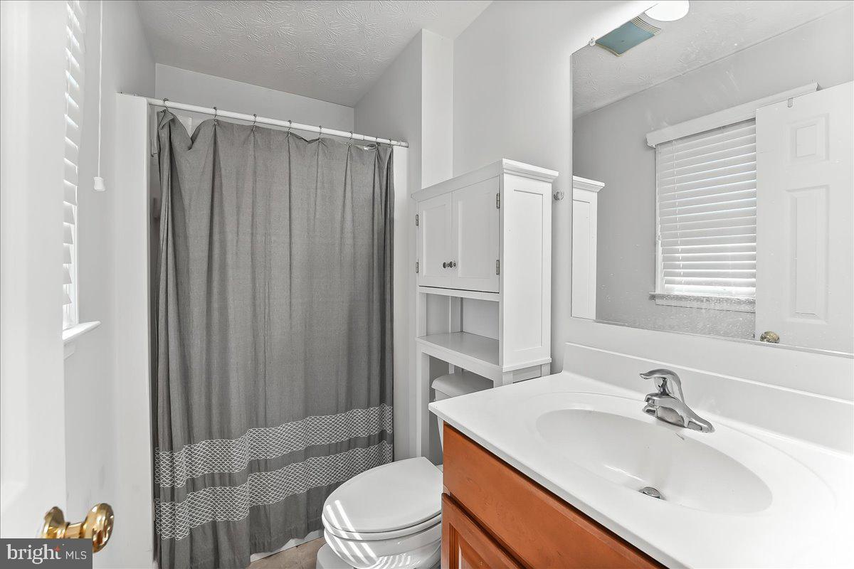 107 Britton Drive Rising Sun, MD 21911 - Photo 22 of 30 a bathroom with a sink toilet a mirror and shower