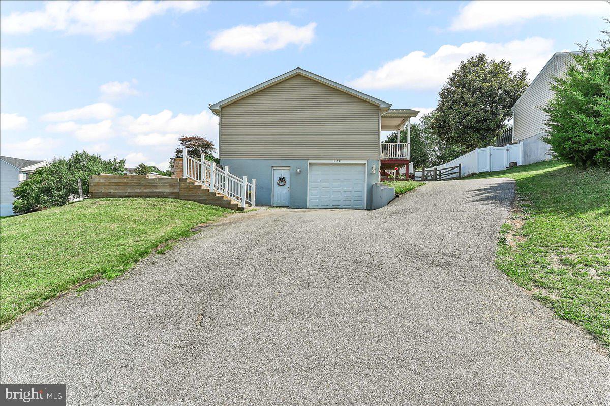 107 Britton Drive Rising Sun, MD 21911 - Photo 26 of 30 a front view of a house with a yard and garage