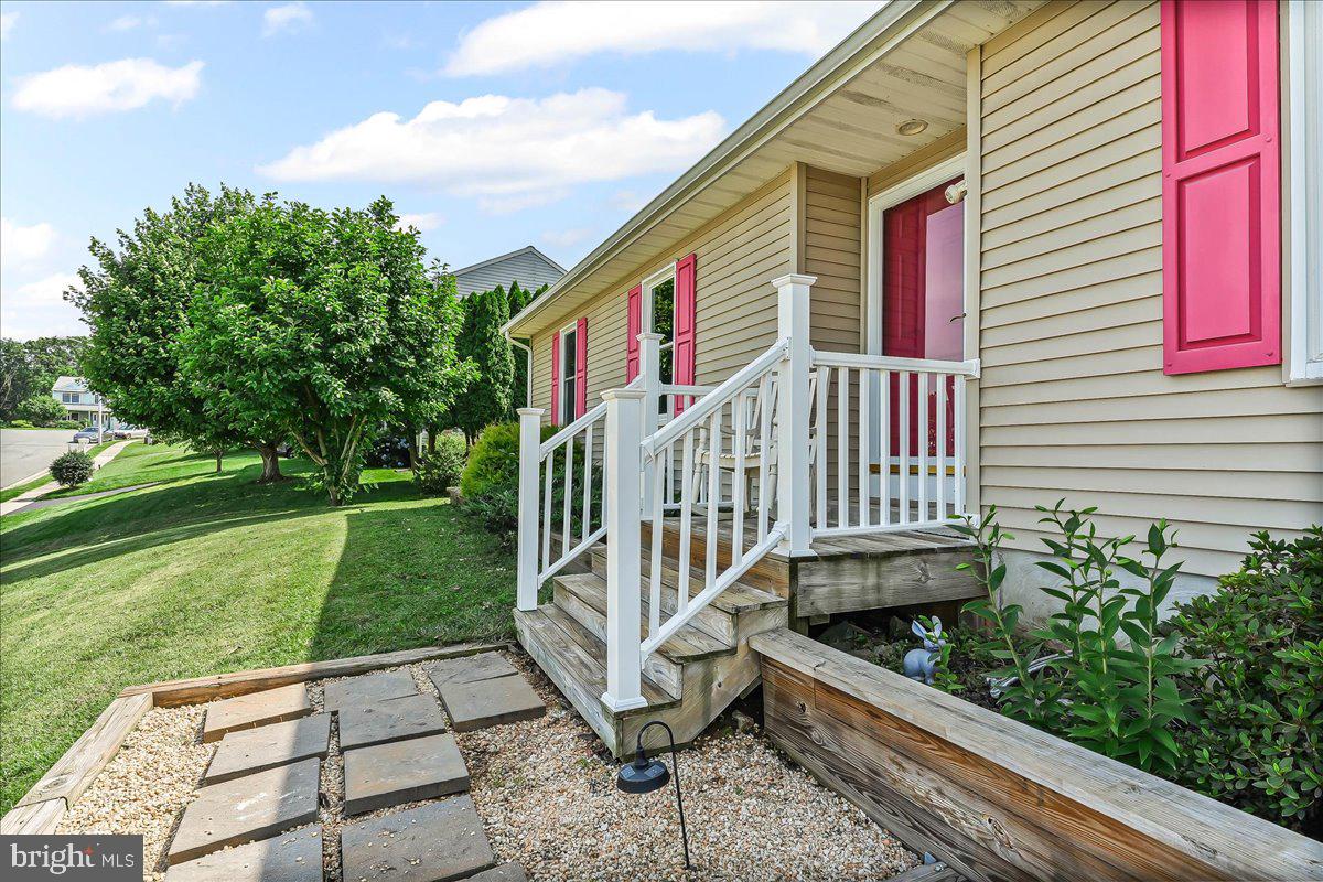 107 Britton Drive Rising Sun, MD 21911 - Photo 4 of 30 a view of a house with a yard and a garden