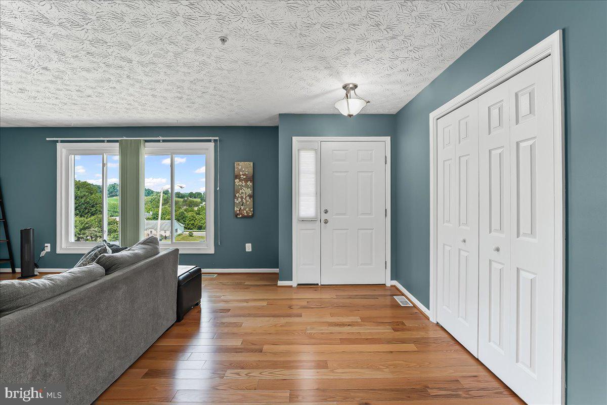 107 Britton Drive Rising Sun, MD 21911 - Photo 6 of 30 a view of a livingroom with wooden floor and furniture