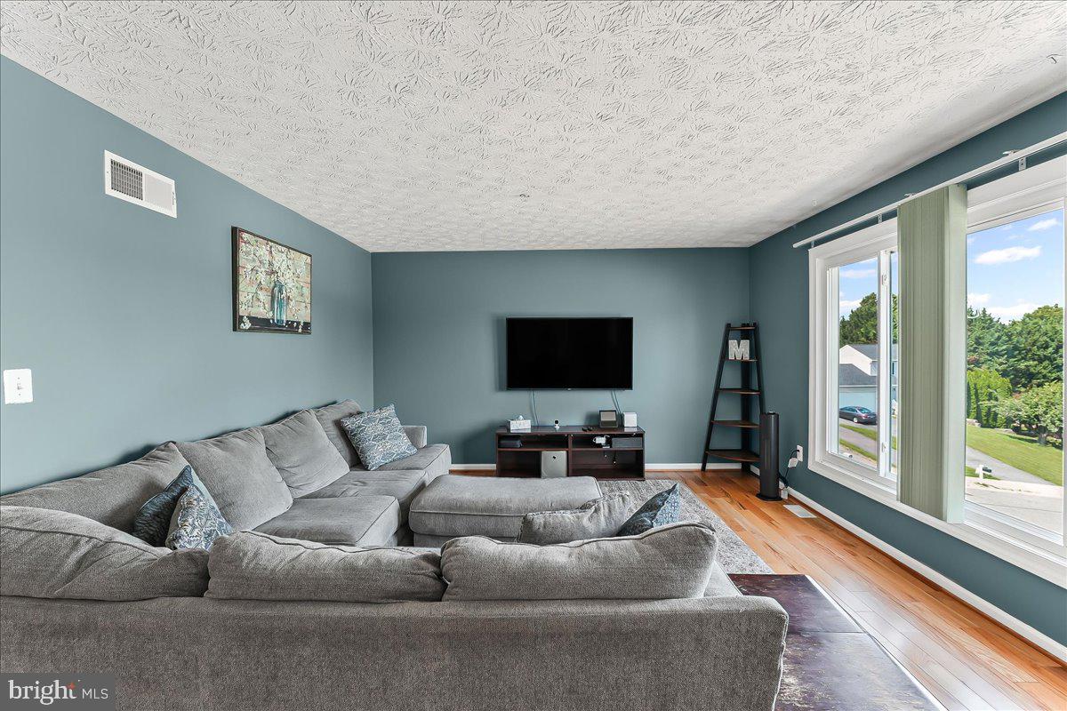 107 Britton Drive Rising Sun, MD 21911 - Photo 8 of 30 a living room with furniture and a flat screen tv