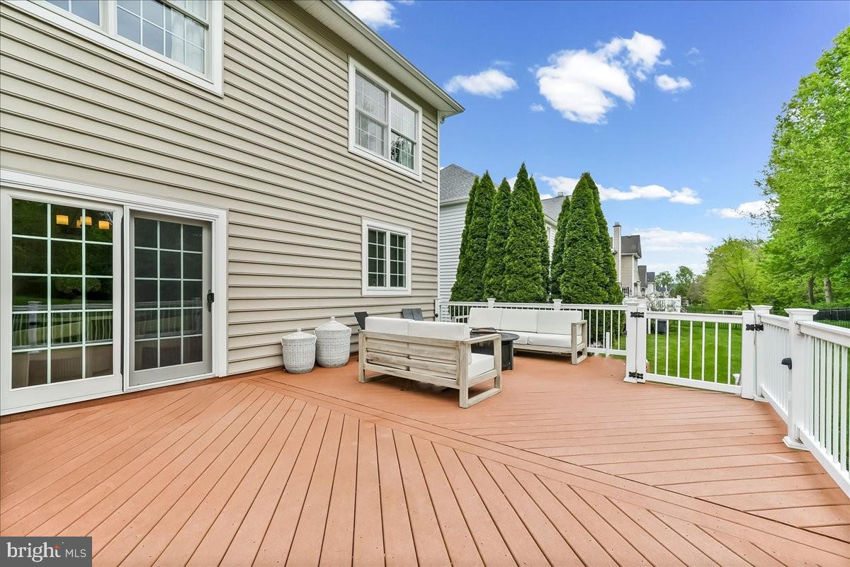 509 Radek Court West Chester, PA 19382 - Photo 33 of 46 Sunny deck with lush greenery backdrop.