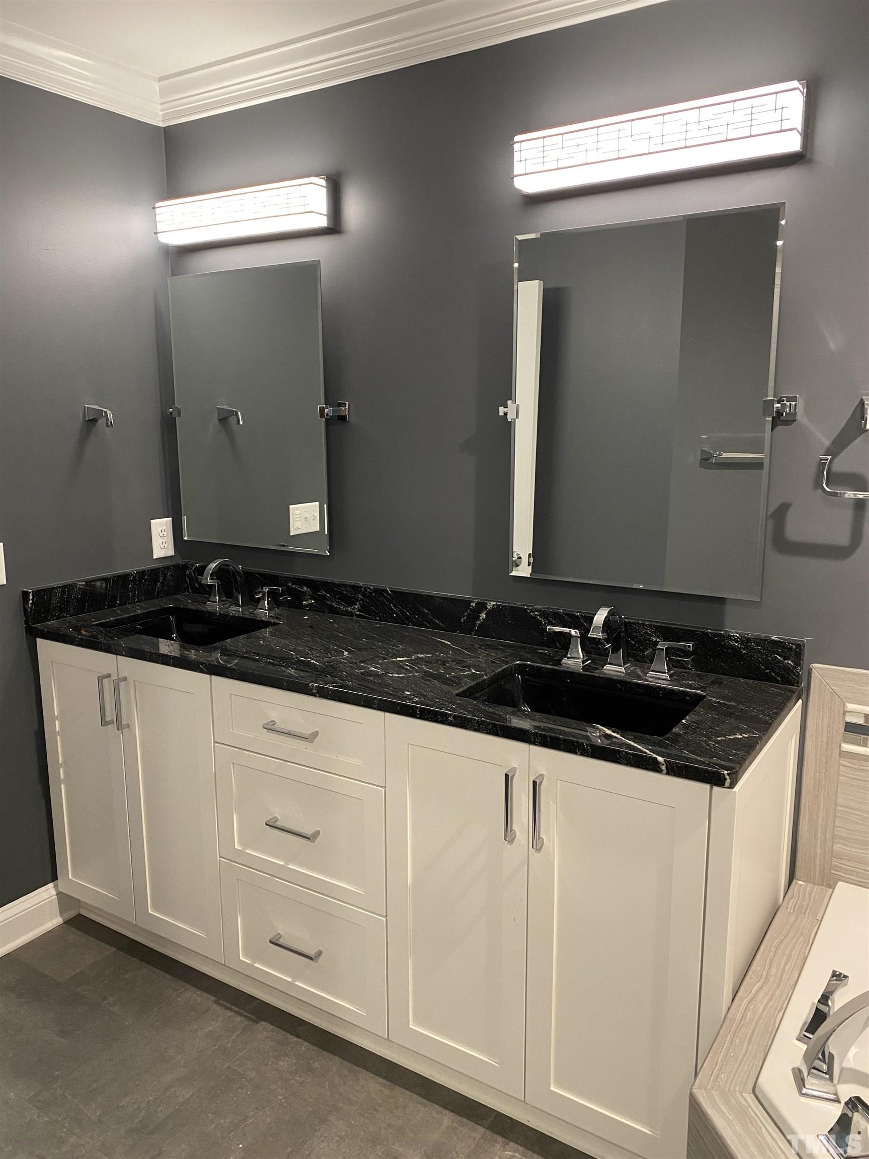 4422 Wellington Ridge Loop, Unit 4422 Cary, NC 27518 - Photo 16 of 40 a close view of a stove a sink and dishwasher with wooden floor
