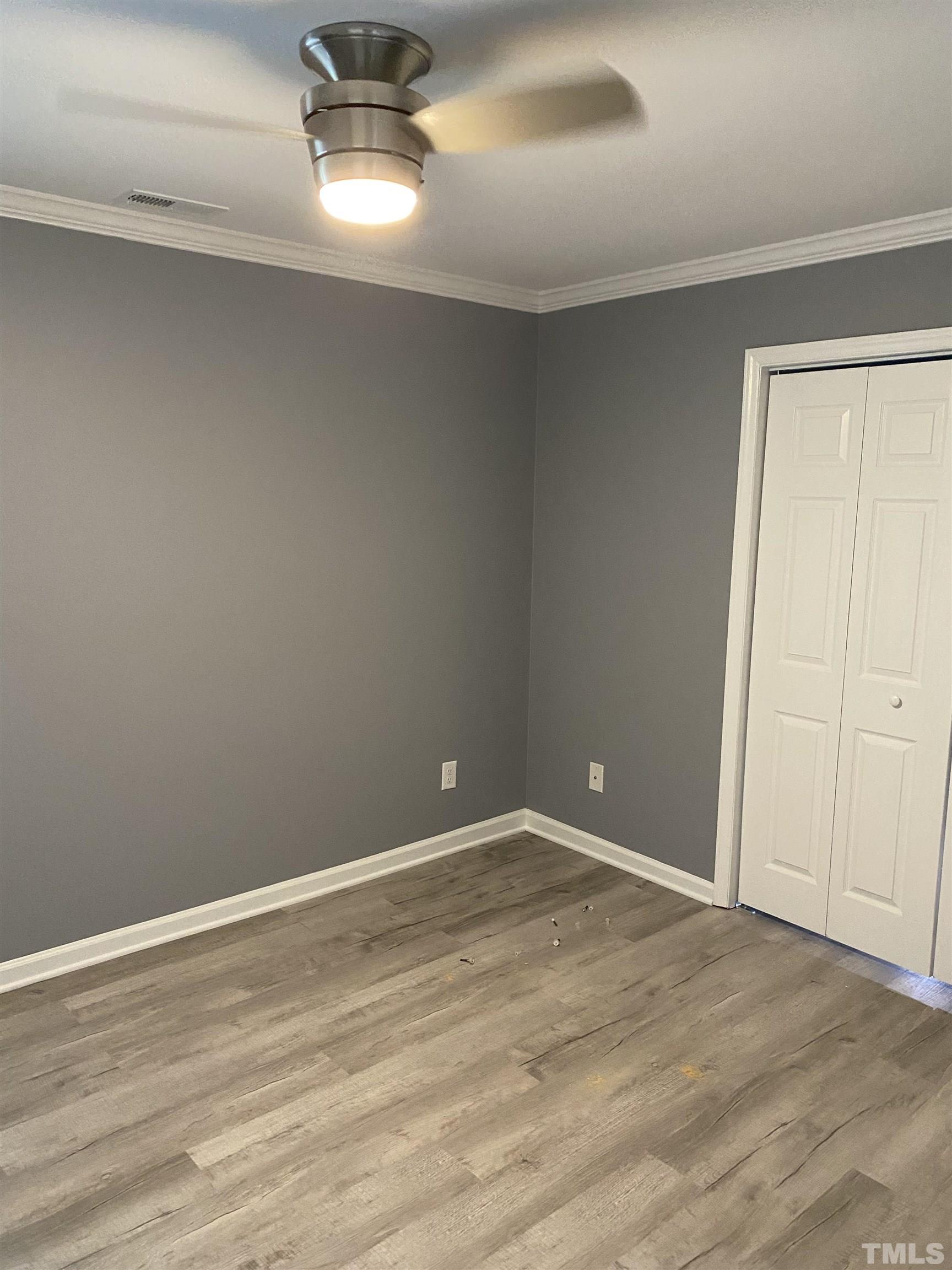 4422 Wellington Ridge Loop, Unit 4422 Cary, NC 27518 - Photo 18 of 40 a view of an empty room with wooden floor
