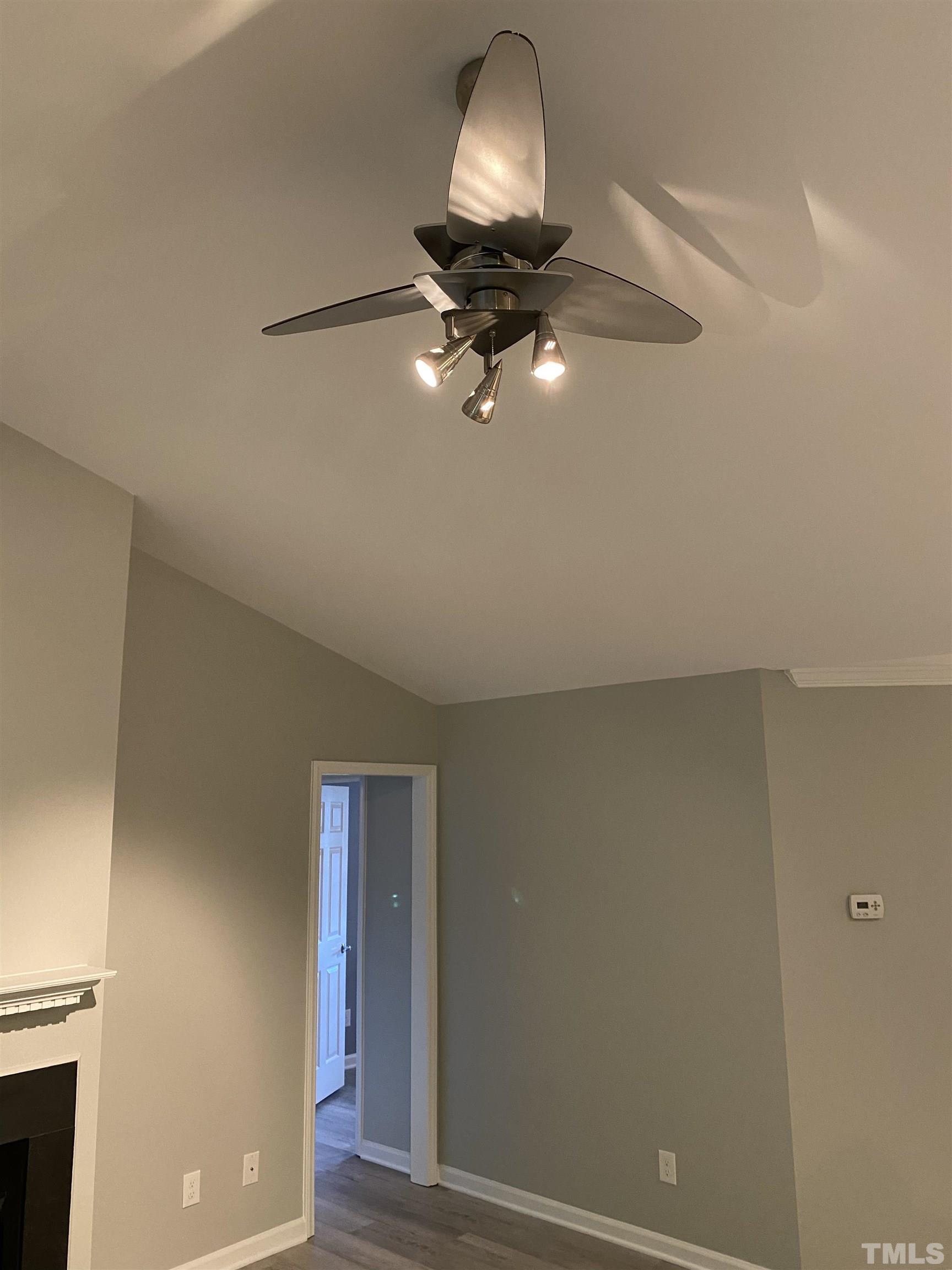 4422 Wellington Ridge Loop, Unit 4422 Cary, NC 27518 - Photo 32 of 40 a view of a livingroom and a chandelier fan