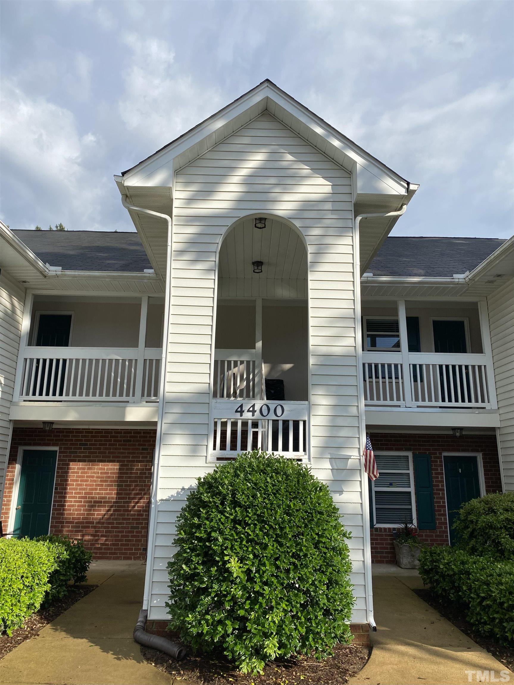 4422 Wellington Ridge Loop, Unit 4422 Cary, NC 27518 - Photo 38 of 40 a front view of a house with garden