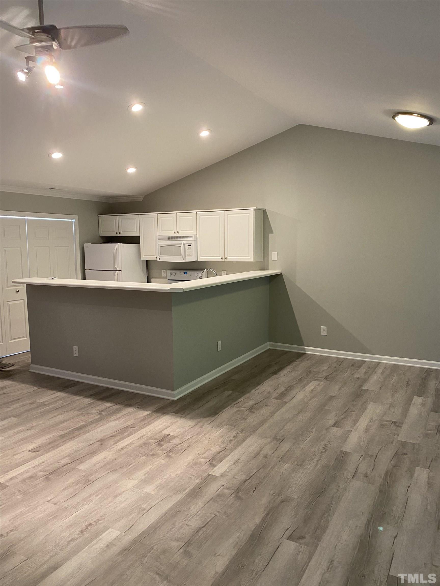 4422 Wellington Ridge Loop, Unit 4422 Cary, NC 27518 - Photo 6 of 40 a view of kitchen and empty room