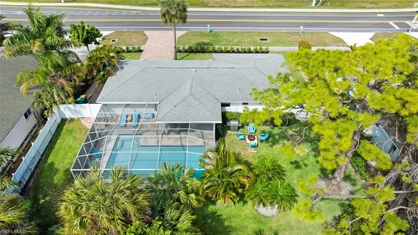 a view of a multi story building with a yard