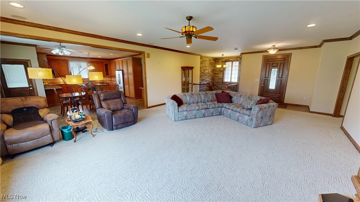 10323 Smith Road Litchfield, OH 44253 - Photo 7 of 50 Living area featuring a ceiling fan, baseboards, light colored carpet, and recessed lighting