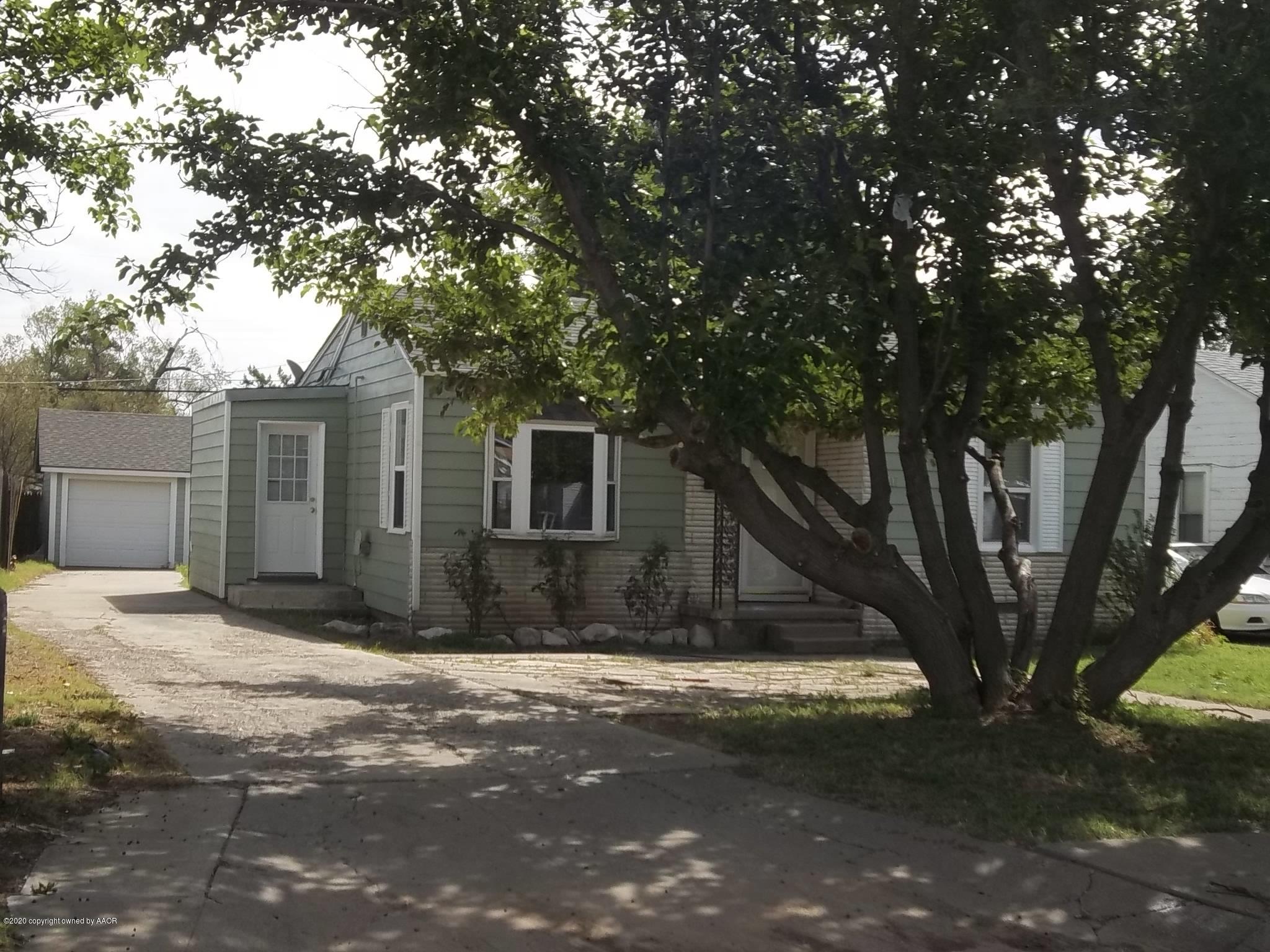 4117 South Tyler Street Amarillo, TX 79110 - Photo 2 of 18 a view of a house with a tree in the background