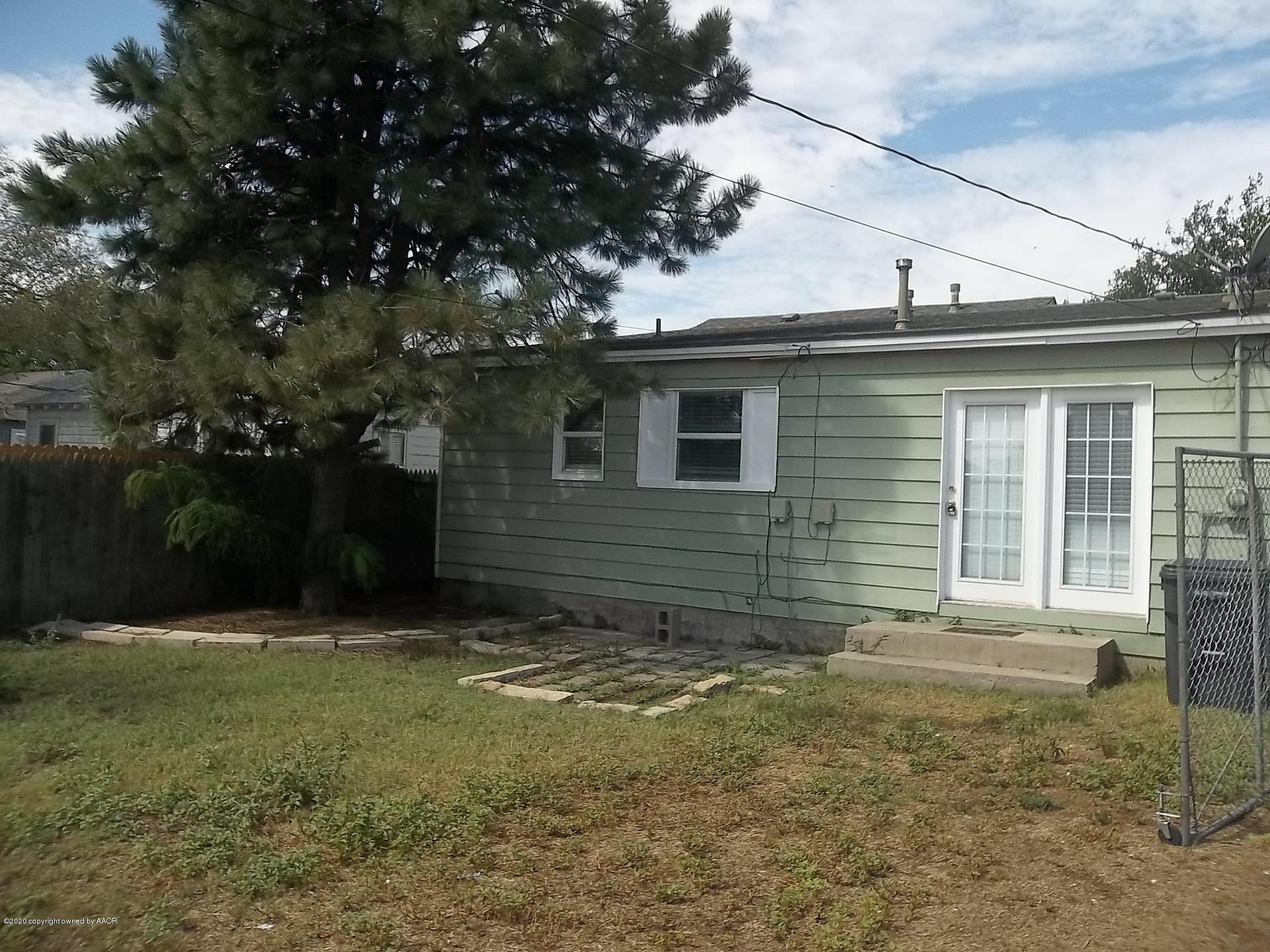 4117 South Tyler Street Amarillo, TX 79110 - Photo 4 of 18 a view of a house with yard and a tree