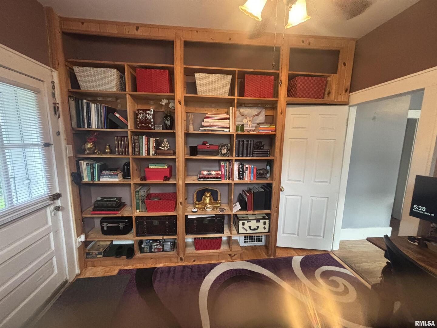 680 Stratton Street Chester, IL 62233 - Photo 12 of 22 a room with water heater and a book shelf