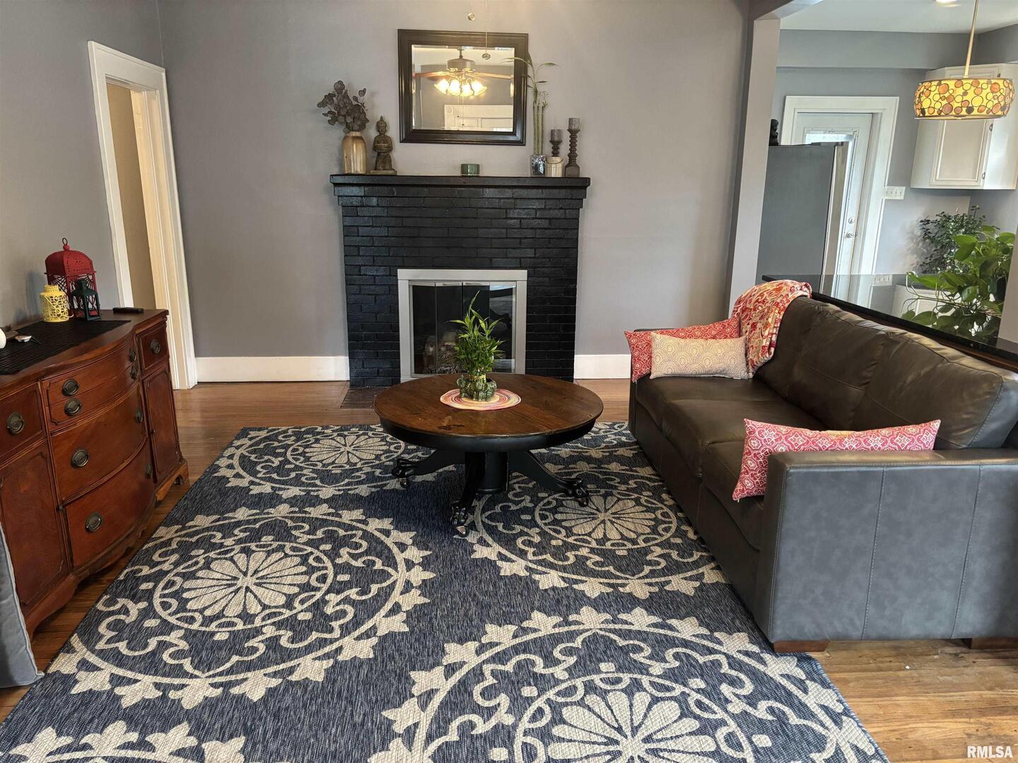 680 Stratton Street Chester, IL 62233 - Photo 18 of 22 a living room with furniture and a fireplace