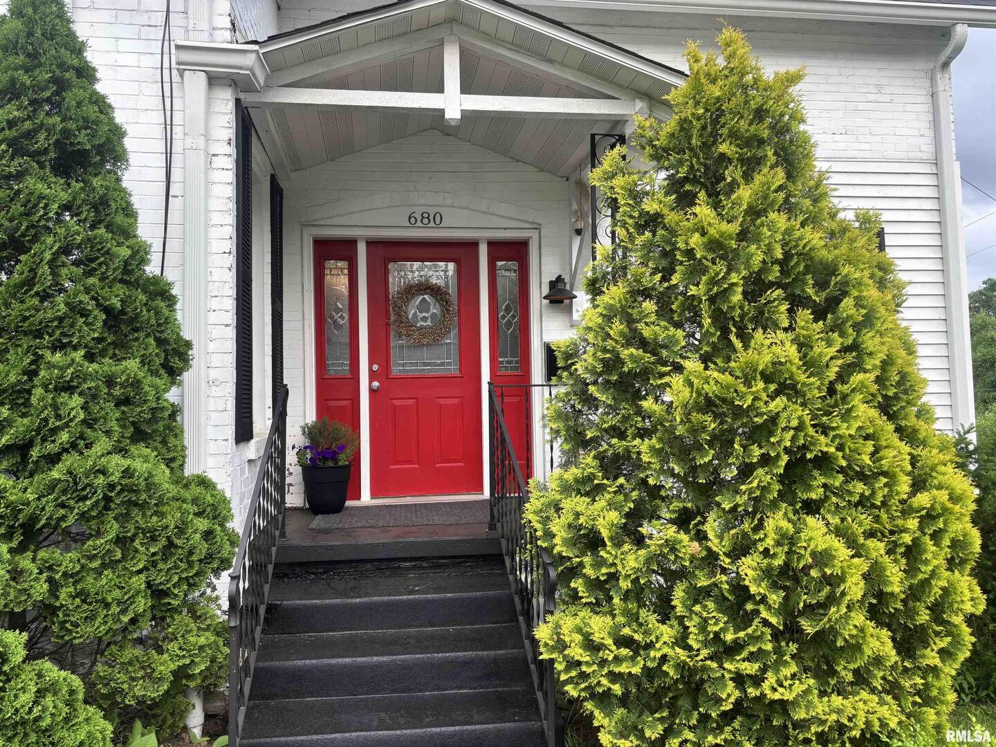 680 Stratton Street Chester, IL 62233 - Photo 2 of 22 a view of a house with a yard