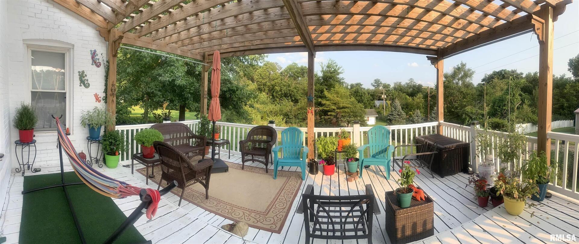 680 Stratton Street Chester, IL 62233 - Photo 4 of 22 a view of a balcony with chairs and a patio