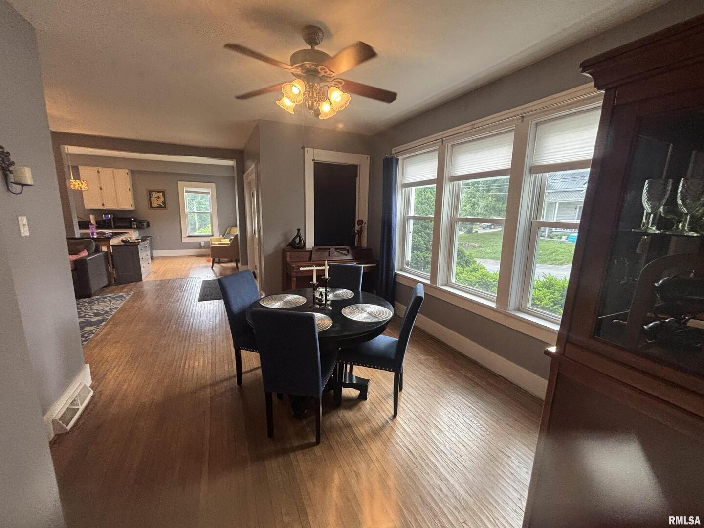 680 Stratton Street Chester, IL 62233 - Photo 10 of 22 a view of a dining room with furniture window and wooden floor