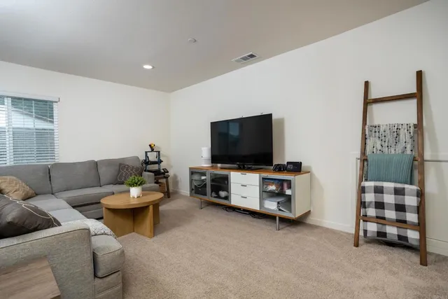 a front view of house with yard and sitting area