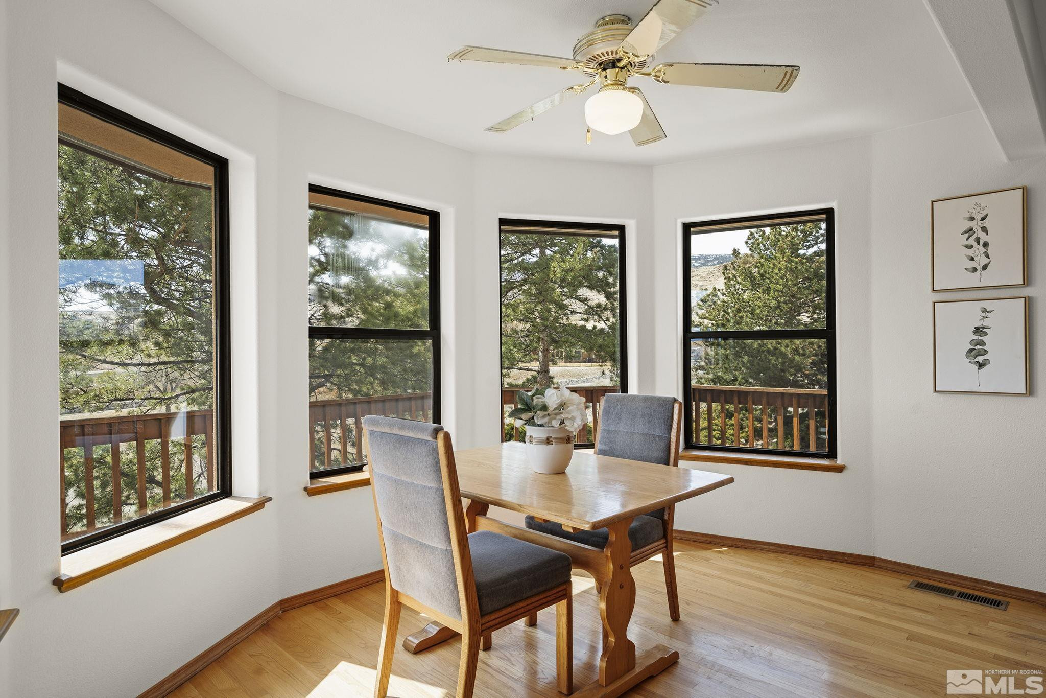 80 Cassas Court Reno, NV 89511 - Photo 16 of 40 a view of a dining room with furniture window and wooden floor