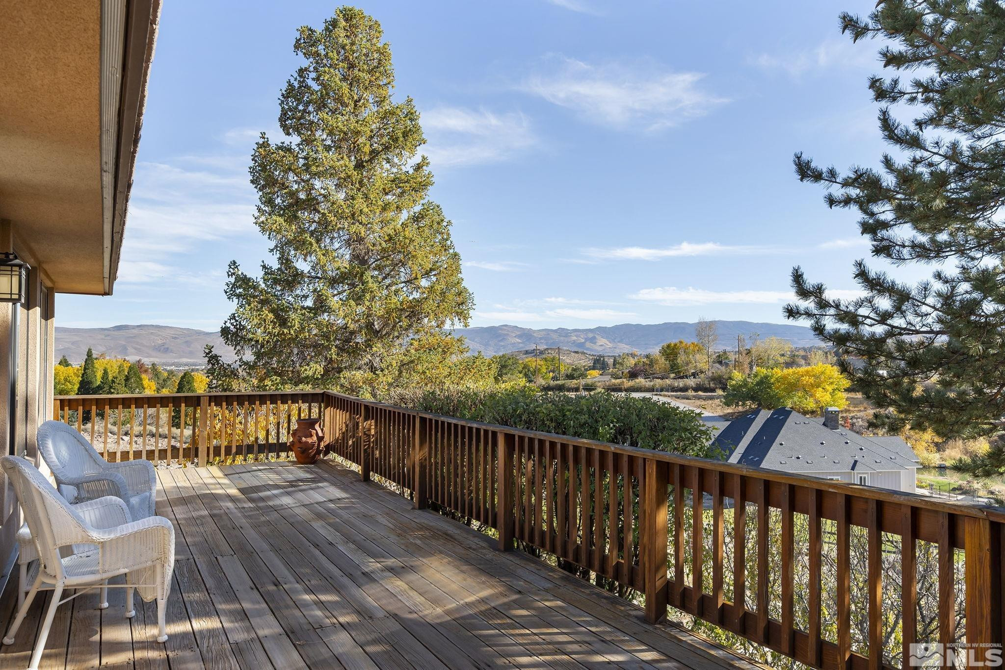 80 Cassas Court Reno, NV 89511 - Photo 17 of 40 a view of a balcony with wooden floor and fence