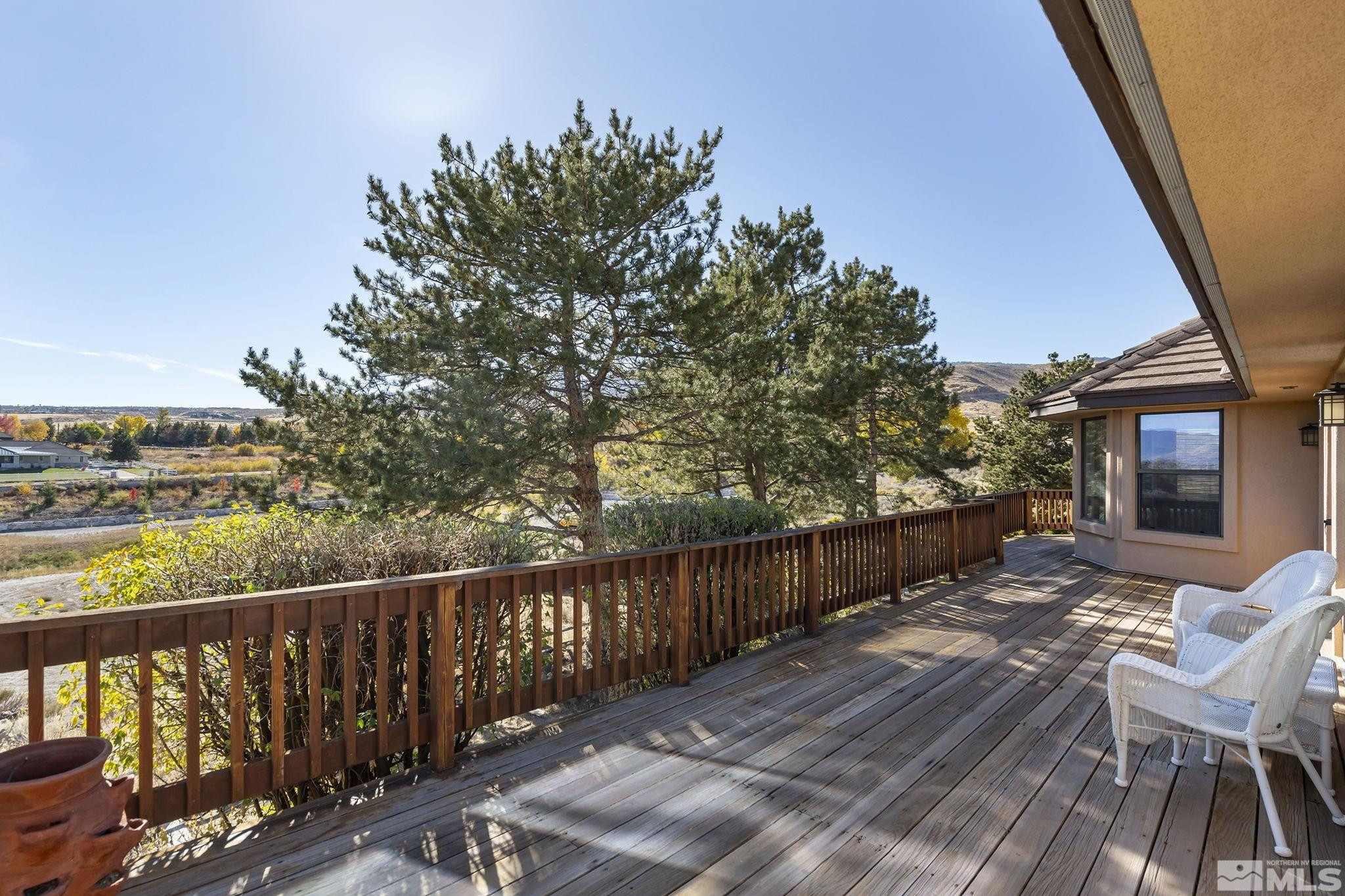 80 Cassas Court Reno, NV 89511 - Photo 18 of 40 a view of deck with furniture and trees around