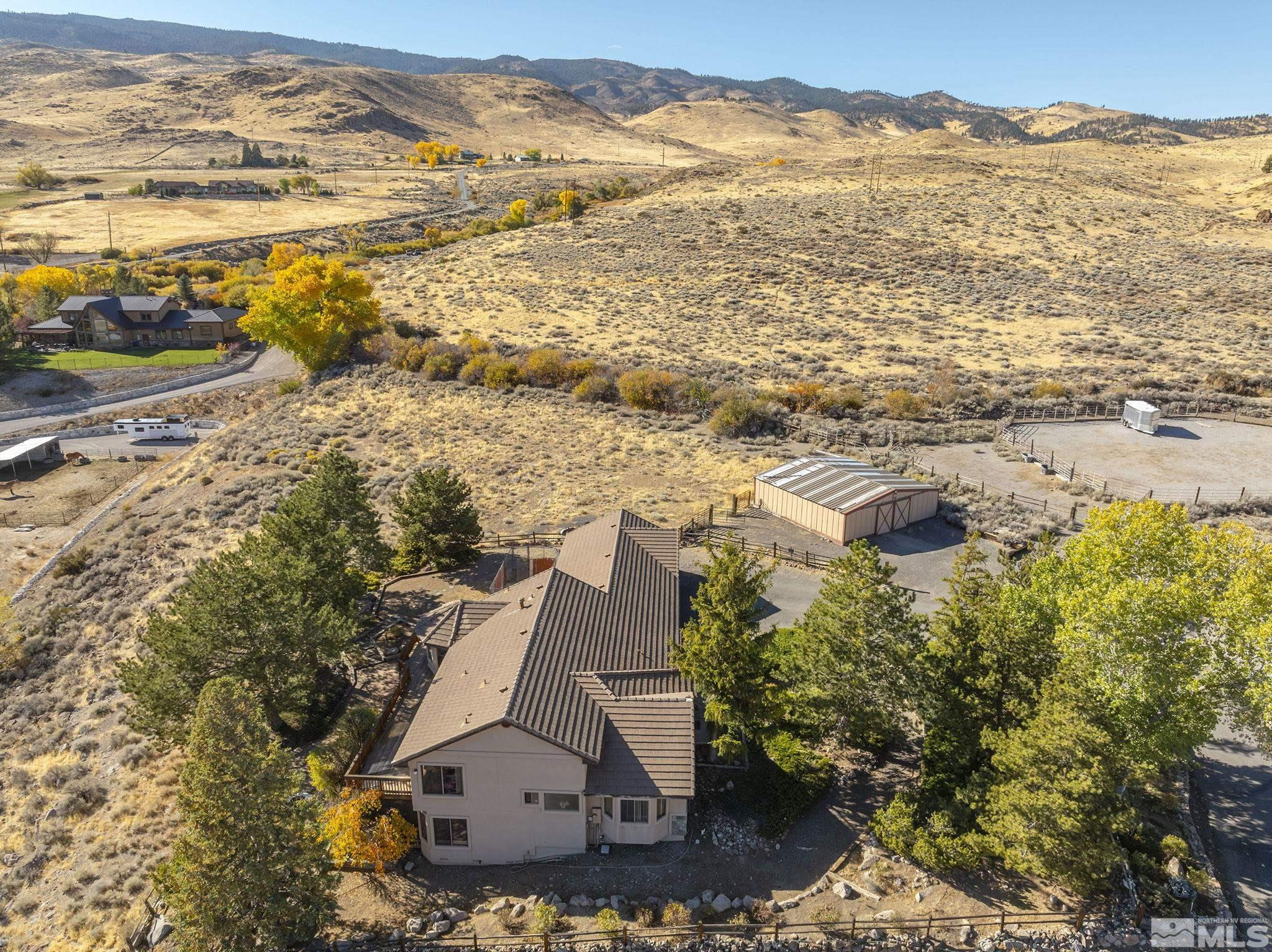 80 Cassas Court Reno, NV 89511 - Photo 2 of 40 an aerial view of residential houses with outdoor space