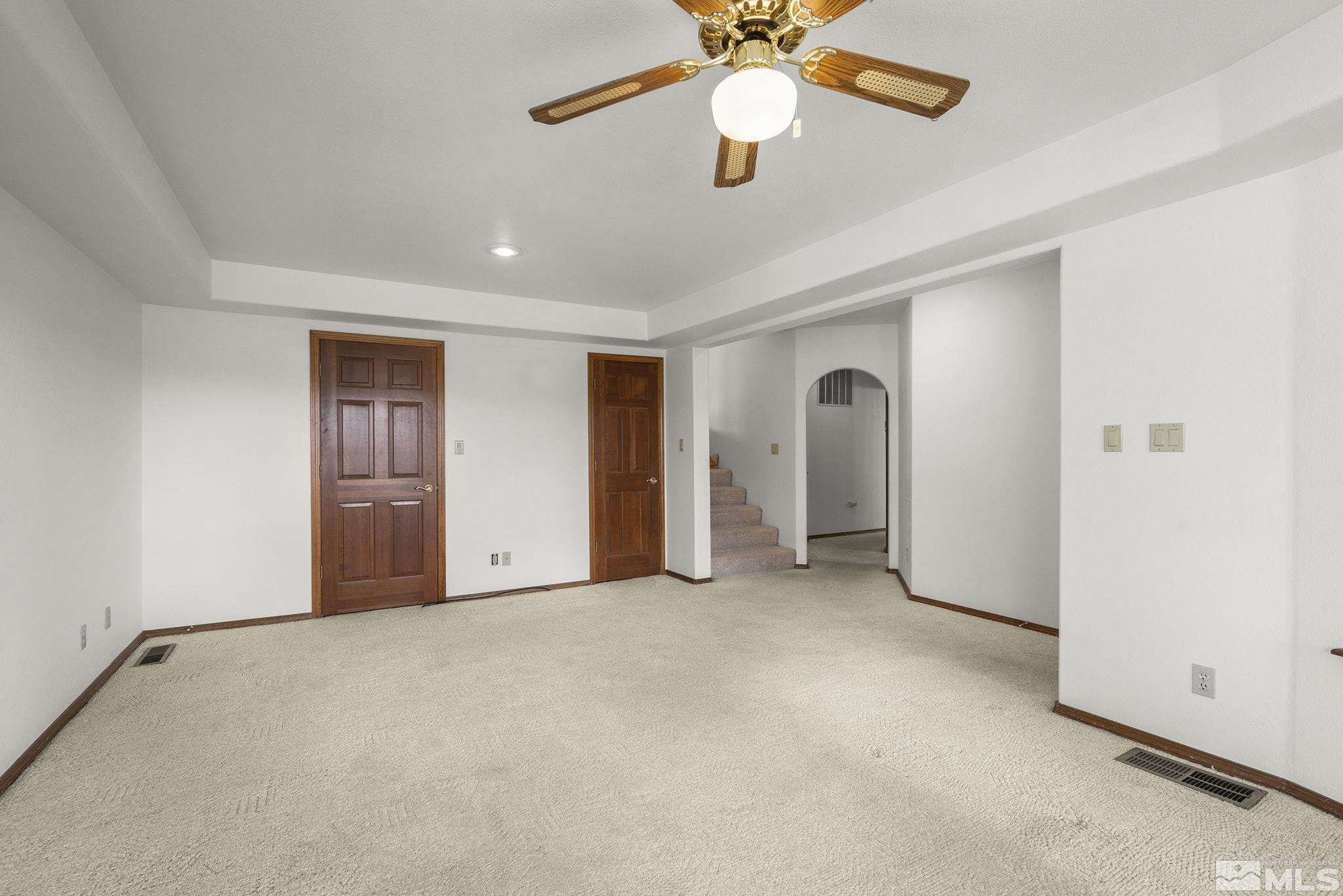 80 Cassas Court Reno, NV 89511 - Photo 25 of 40 an empty room with chandelier fan and windows