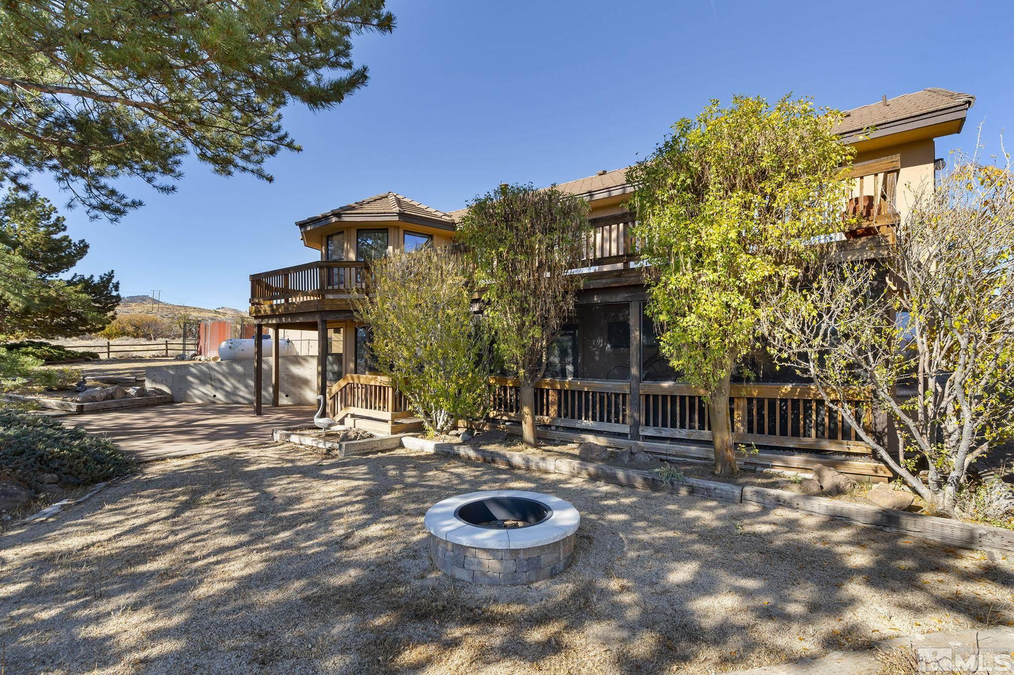 80 Cassas Court Reno, NV 89511 - Photo 37 of 40 a backyard of a house with table and chairs
