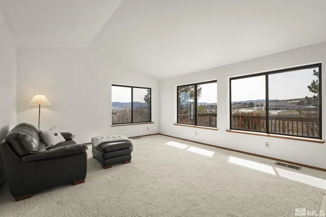a view of a dining room with furniture window and outside view