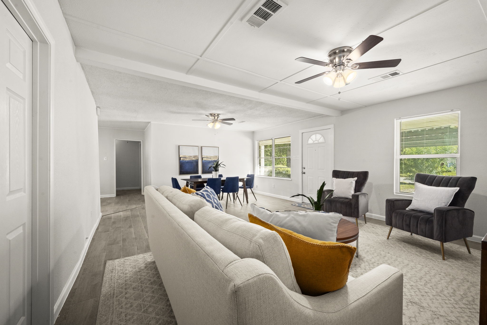 5219 Myrtlewood Street Houston, TX 77033 - Photo 11 of 36 a living room with furniture and a large window