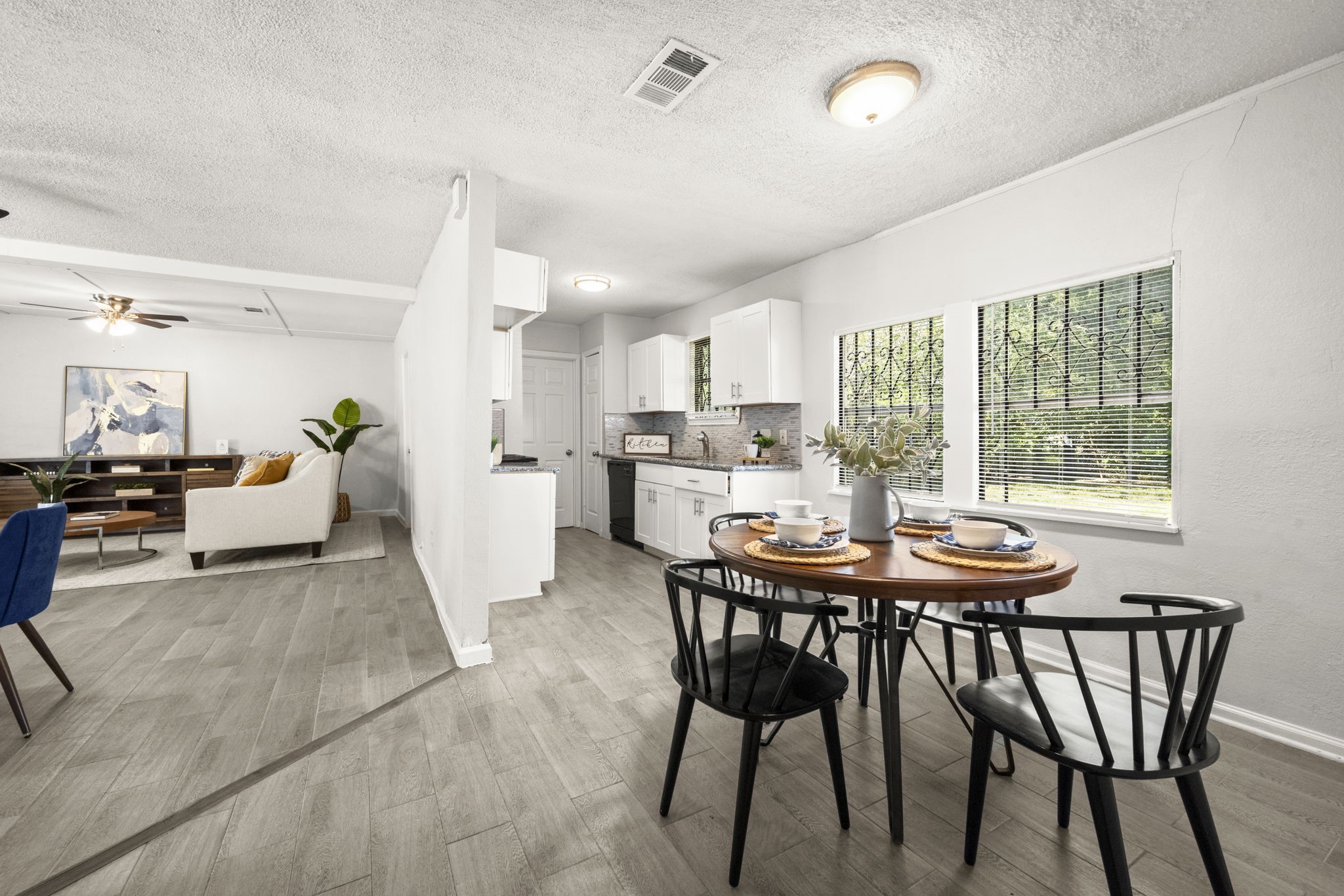 5219 Myrtlewood Street Houston, TX 77033 - Photo 13 of 36 a view of a dining room with furniture and a table