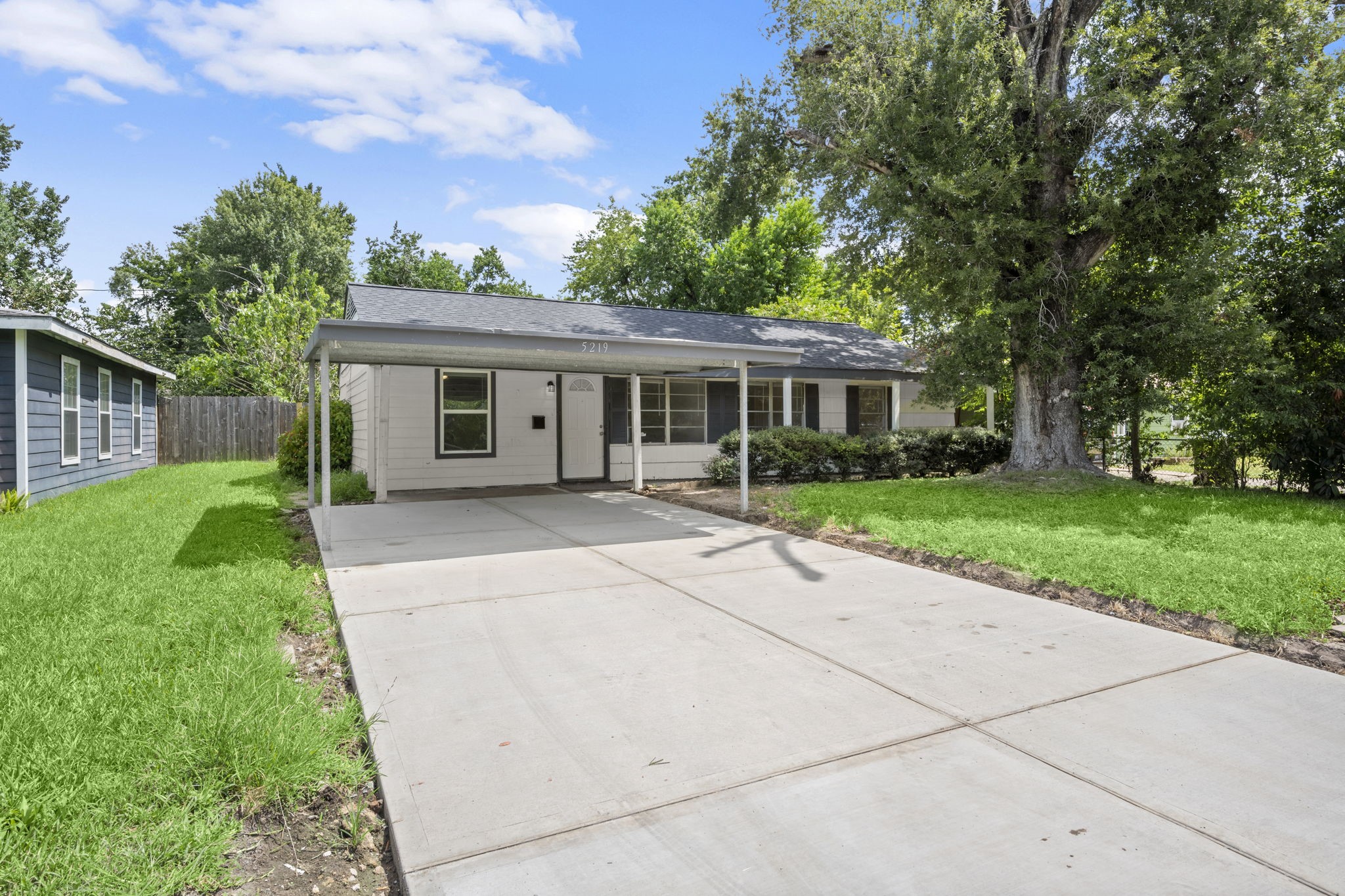 5219 Myrtlewood Street Houston, TX 77033 - Photo 2 of 36 front view of house with a yard