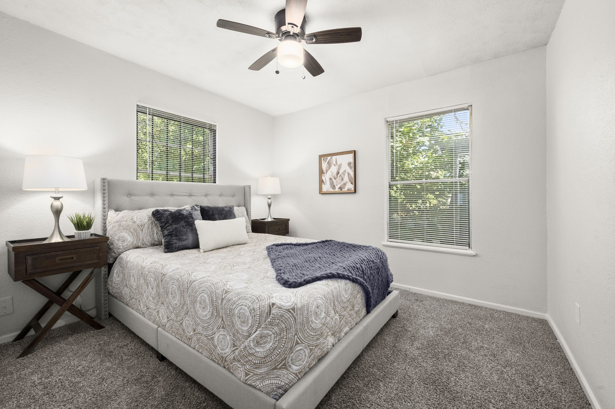 5219 Myrtlewood Street Houston, TX 77033 - Photo 21 of 36 a bedroom with bed and window