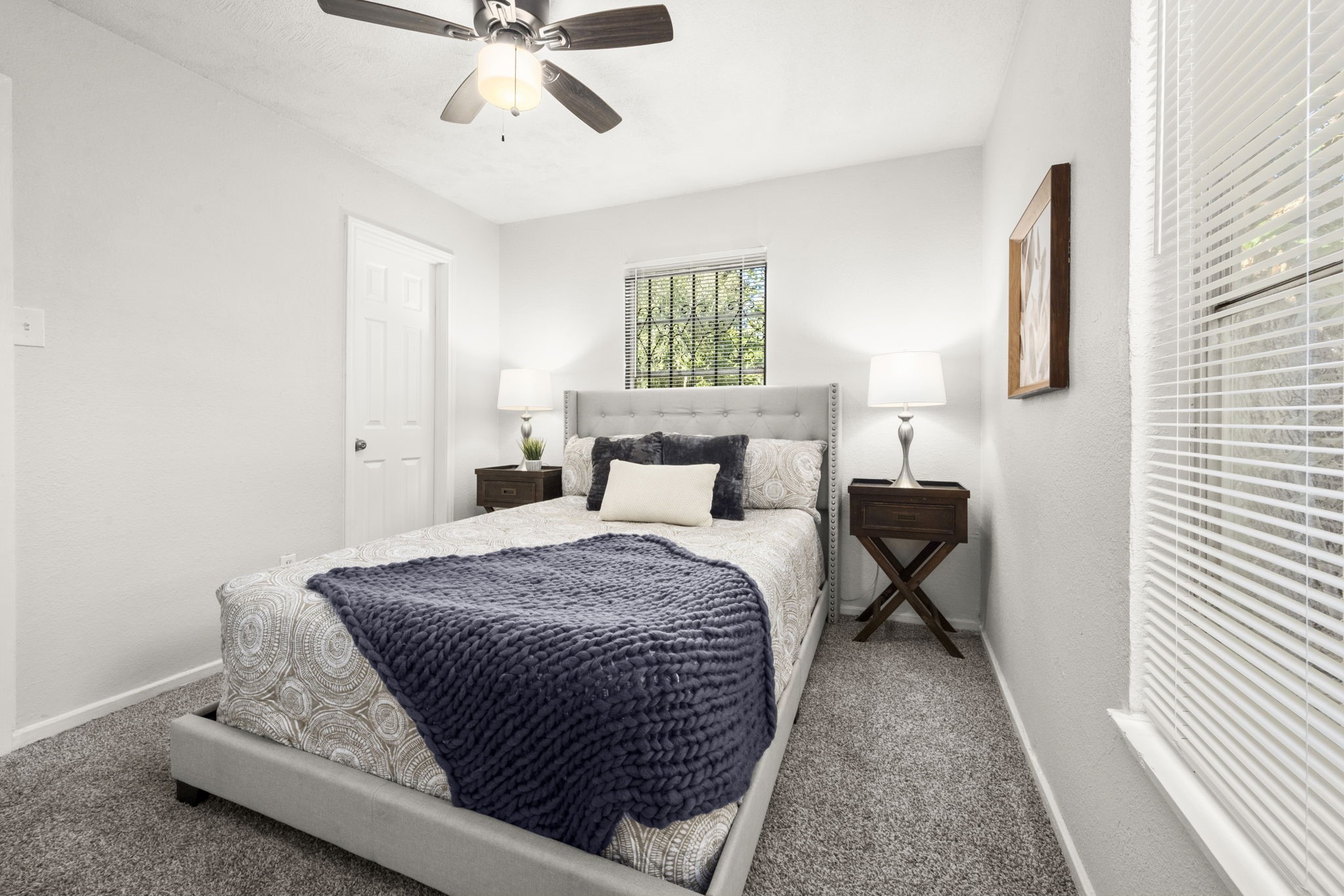 5219 Myrtlewood Street Houston, TX 77033 - Photo 22 of 36 a bedroom with a bed and window