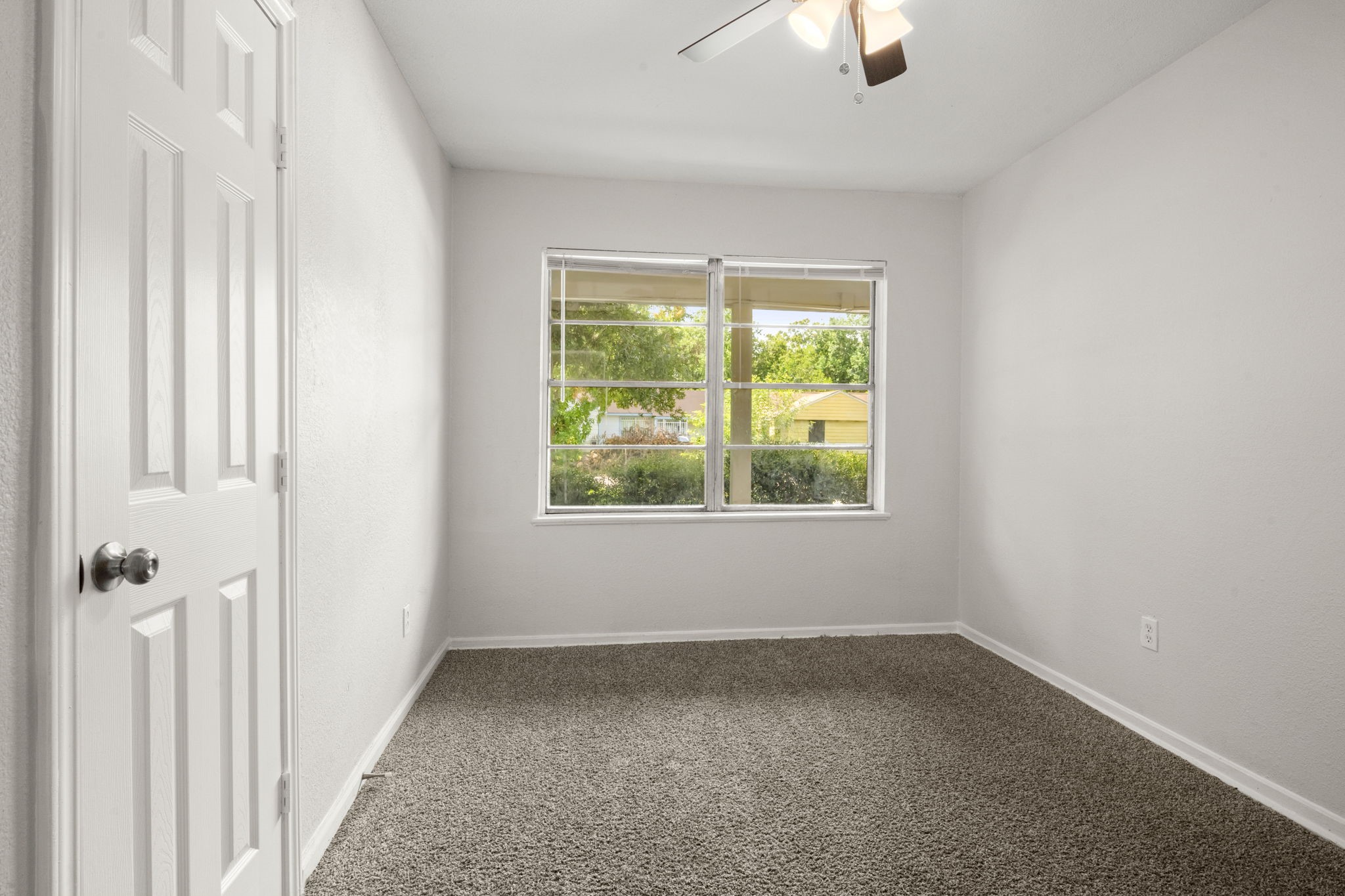 5219 Myrtlewood Street Houston, TX 77033 - Photo 25 of 36 an empty room with a window