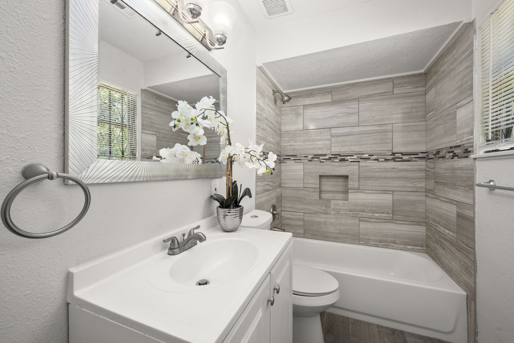 5219 Myrtlewood Street Houston, TX 77033 - Photo 27 of 36 a bathroom with a sink a toilet and shower