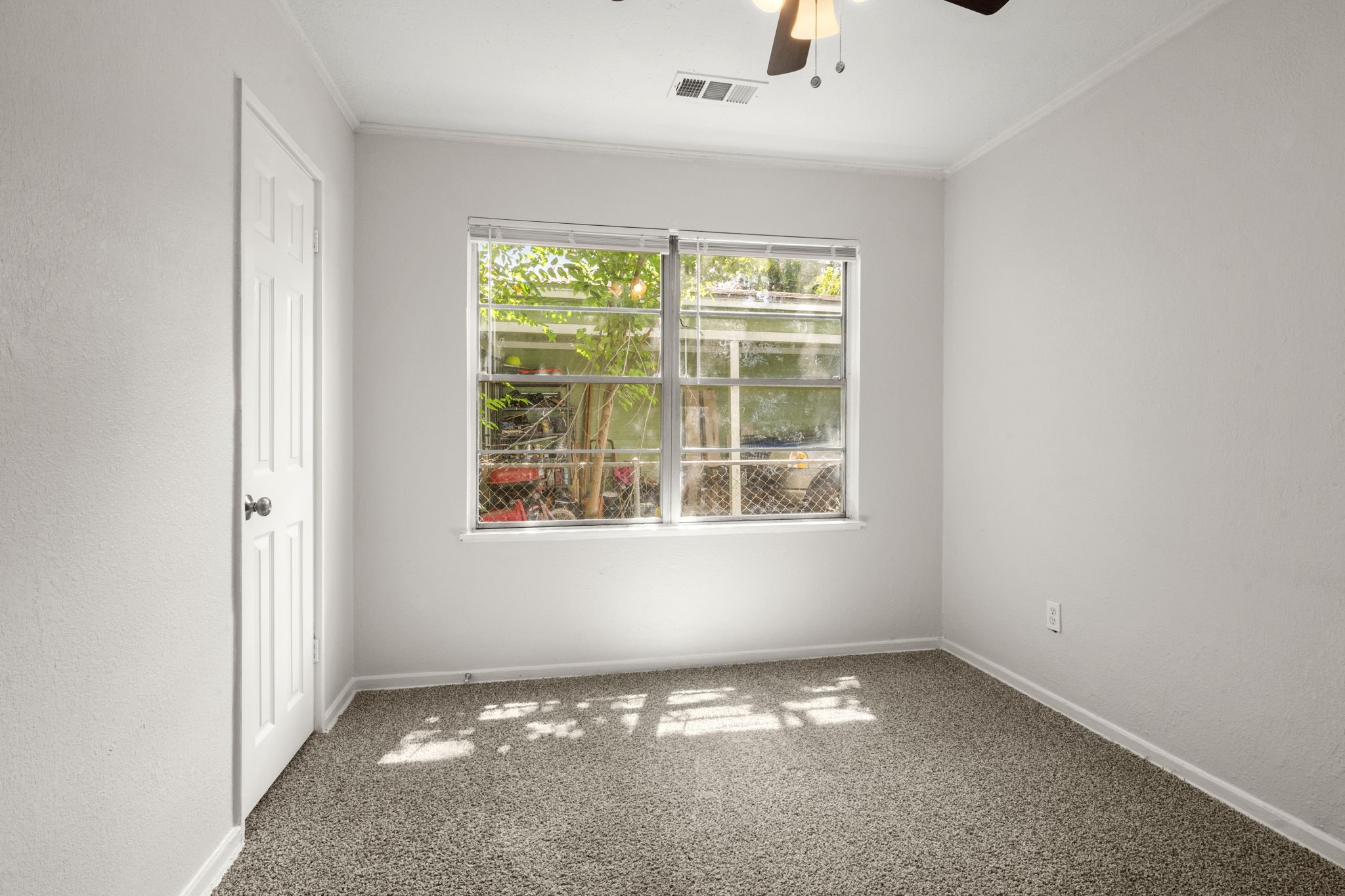 5219 Myrtlewood Street Houston, TX 77033 - Photo 28 of 36 an empty room with a window